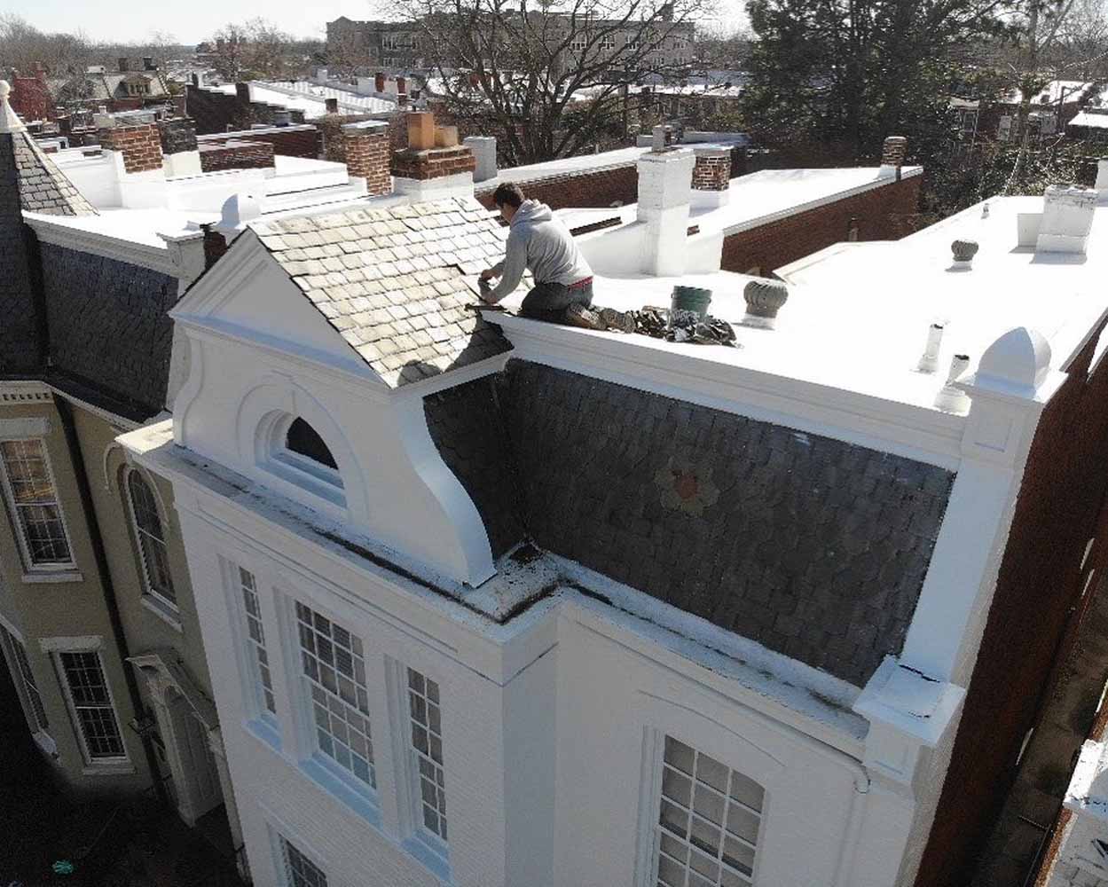 Leak repair work on a slate roof