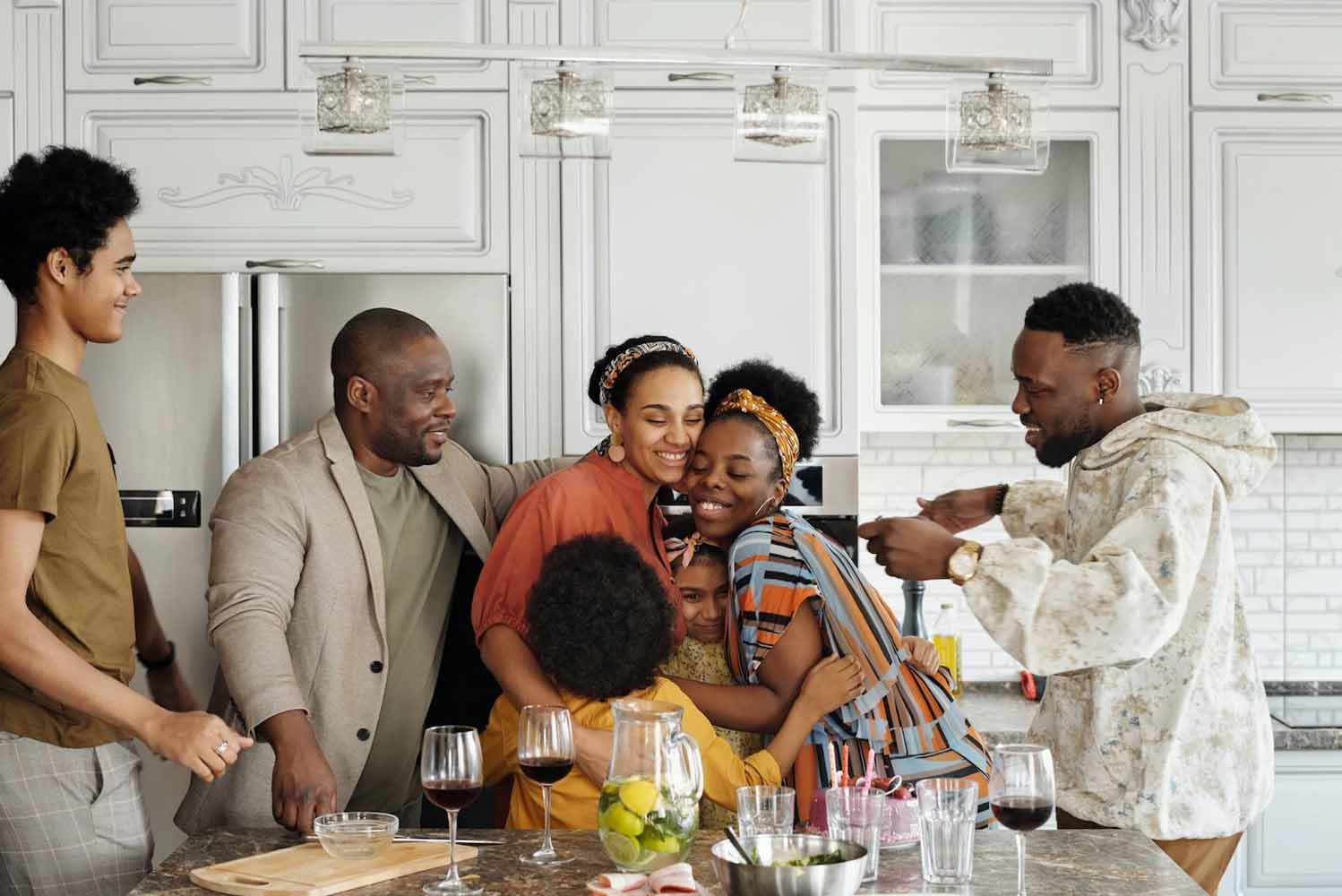 Family group hug in the kitchen