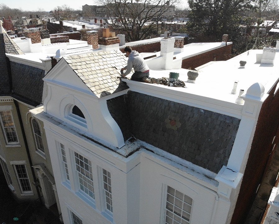 Hammersmith Roofing professional repairing the roof on a historic Richmond home