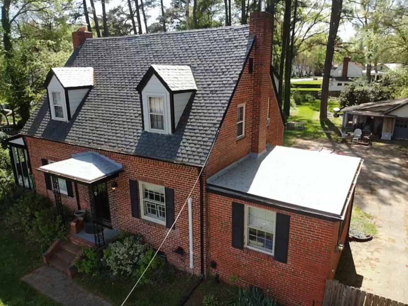 Black slate roof on a brick home