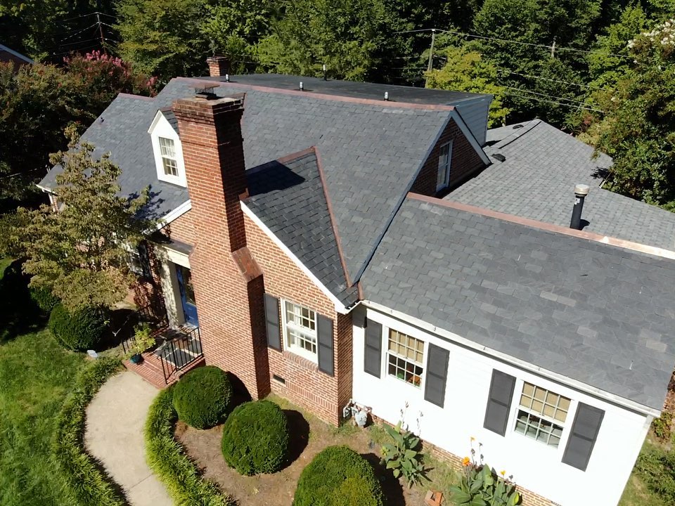 A slate roof with copper flashing really boosts this home’s curb appeal